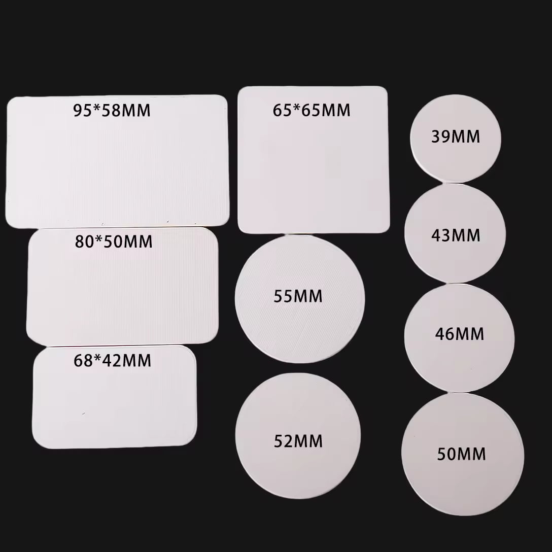 A collection of white rectangular and circular blank items with various dimensions labeled on them, arranged against a black background.